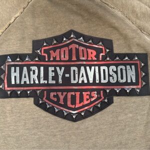 Woman’s new medium Harley Davidson sweatshirt with stud embellishments on back.